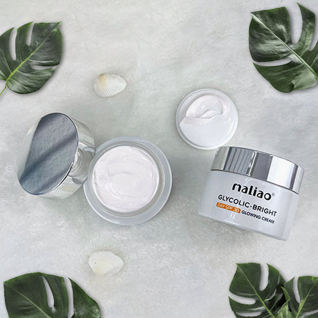 Maliao skincare cream jars with green leaves on a light background. maliao.pk