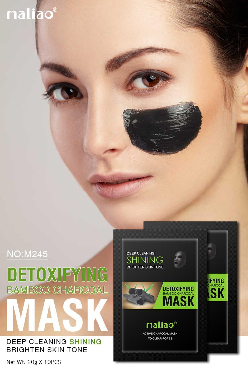 Woman wearing a detoxifying bamboo charcoal mask with Maliao product packaging. maliao.pk