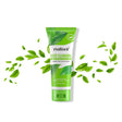 Green tube of maliao Deep Cleansing Green Tea Face Wash with green leaves on a white background