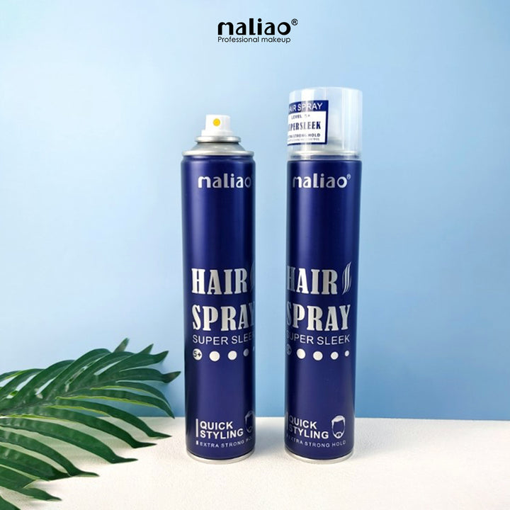Two bottles of maliao hair spray on a light blue background with a leafy plant.