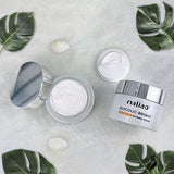 Maliao skincare cream jars with green leaves on a light background. maliao.pk