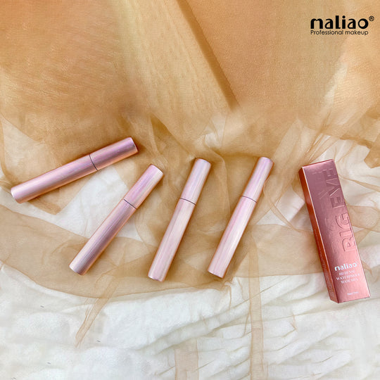 Set of pink makeup products on a textured beige and white background with 'maliao' branding. maliao.pk