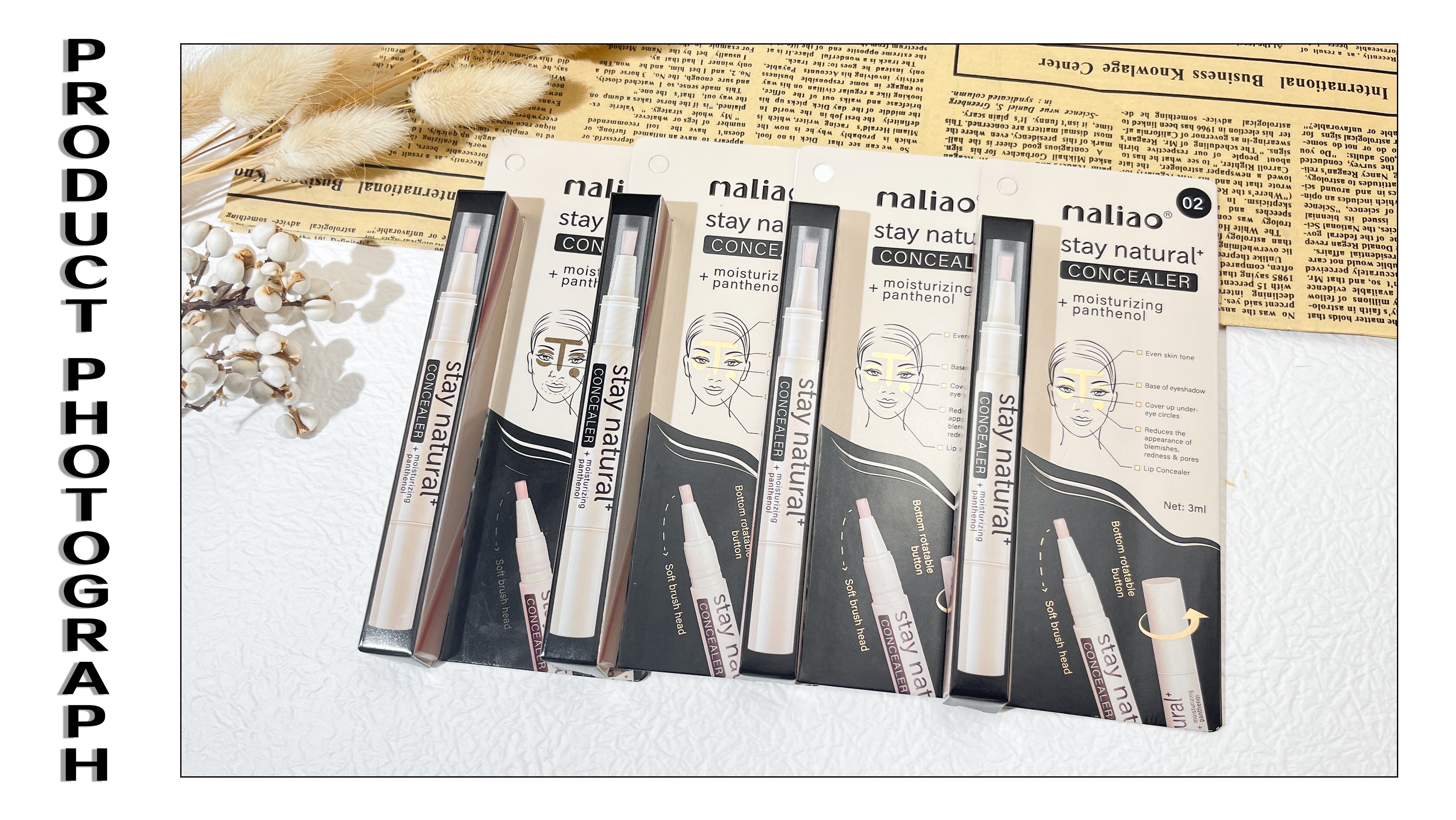 Set of concealer products with packaging on a textured surface. maliao.pk